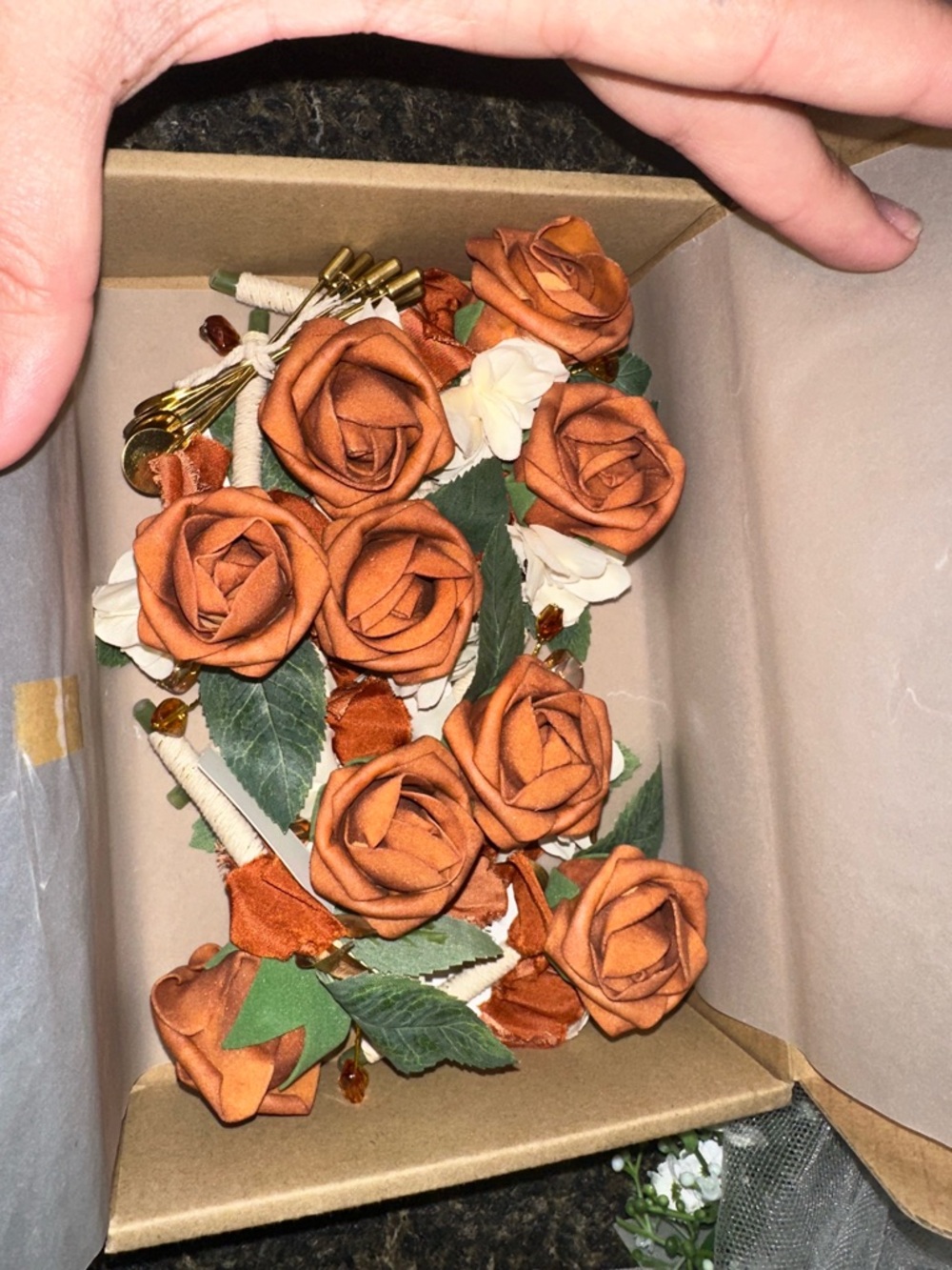 9 piece Rust Orange Rose Boutonniere Set with Cream Accents and Green Leaves